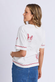 A model wearing the Paradise Cotton Tee in colour Vintawhite (White), from the back