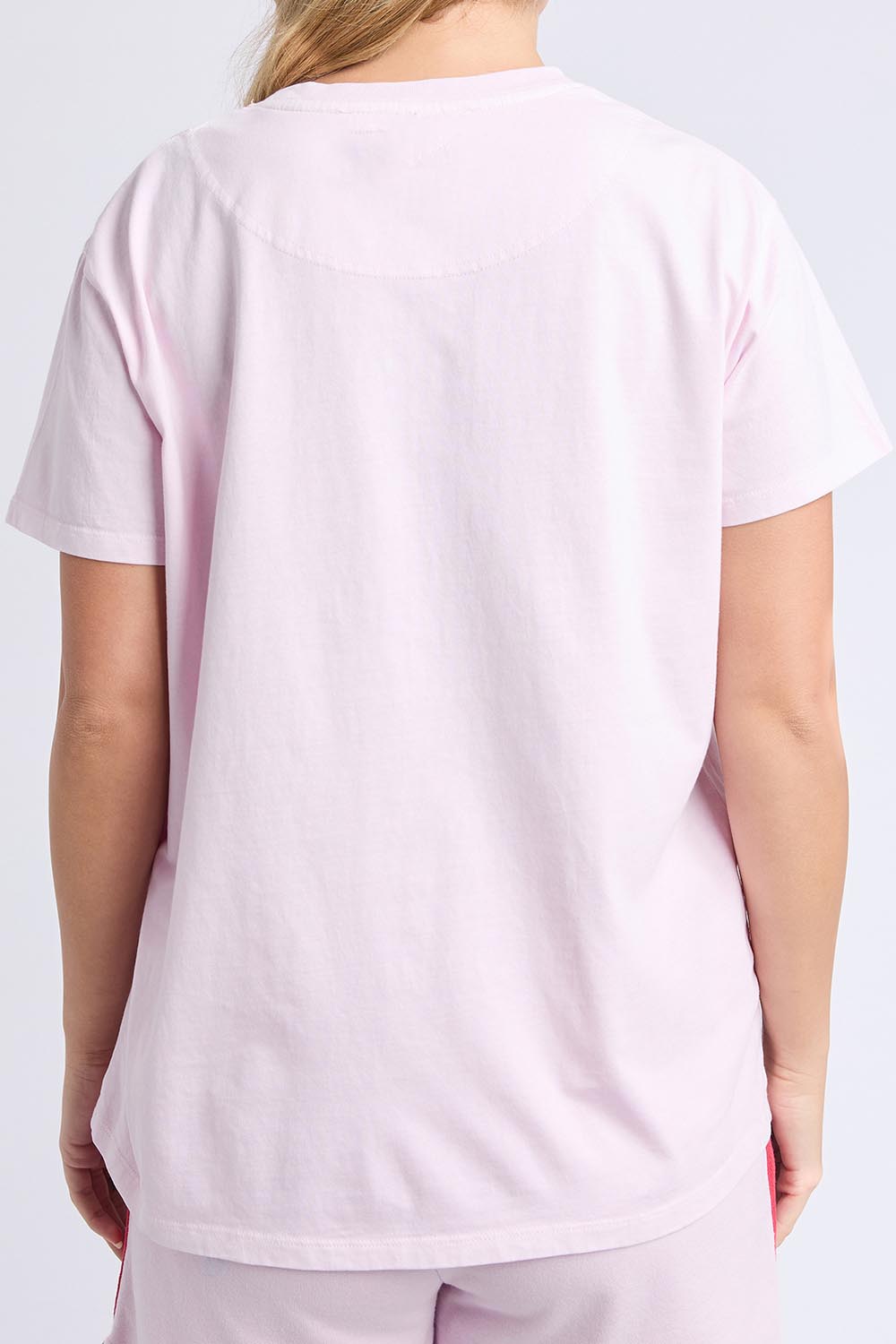 A model wearing the Palermo Cotton Tee in colour Lavender (Purple), from the back