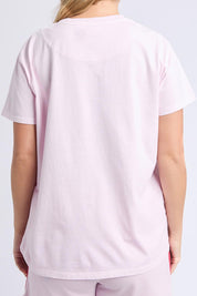 A model wearing the Palermo Cotton Tee in colour Lavender (Purple), from the back