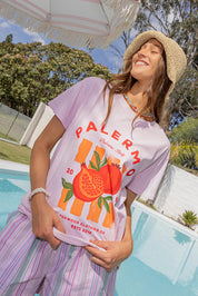A model wearing the Palermo Cotton Tee in colour Lavender (Purple), from the front, showing the whole outfit