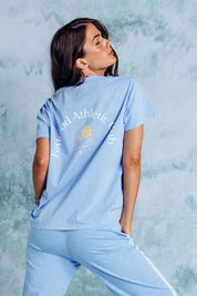 A model wearing the Club Cotton Tee in colour Blue (Blue), from the back