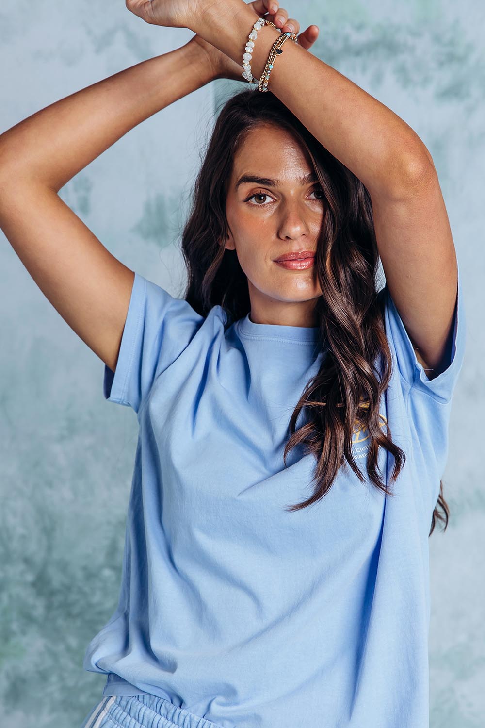 A model wearing the Club Cotton Tee in colour Blue (Blue), from the front, showing the whole outfit