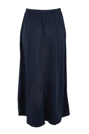 Product shot of the Evolve Cotton Skirt in colour Navy (Blue), from the back