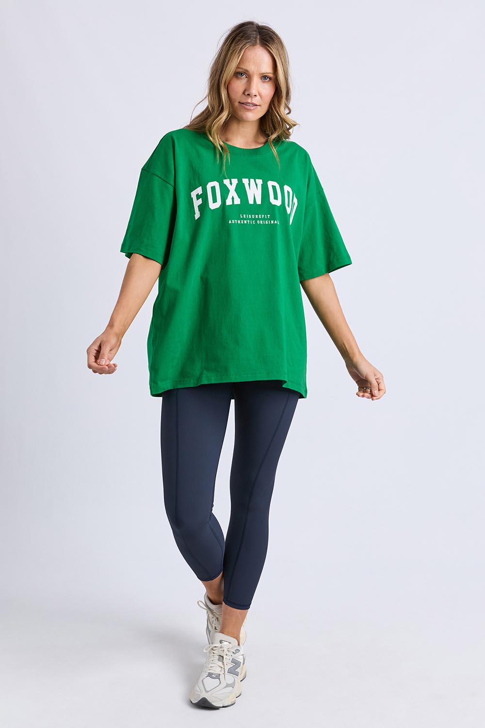 A model wearing the Interval Cotton Tee in colour Green (Green), from the front, showing the whole outfit