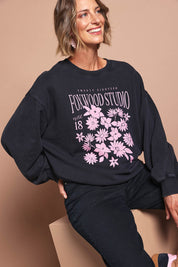 Model Riina wearing size 10 of the Floret Crew in colour Black (Black), from the front, showing the whole outfit