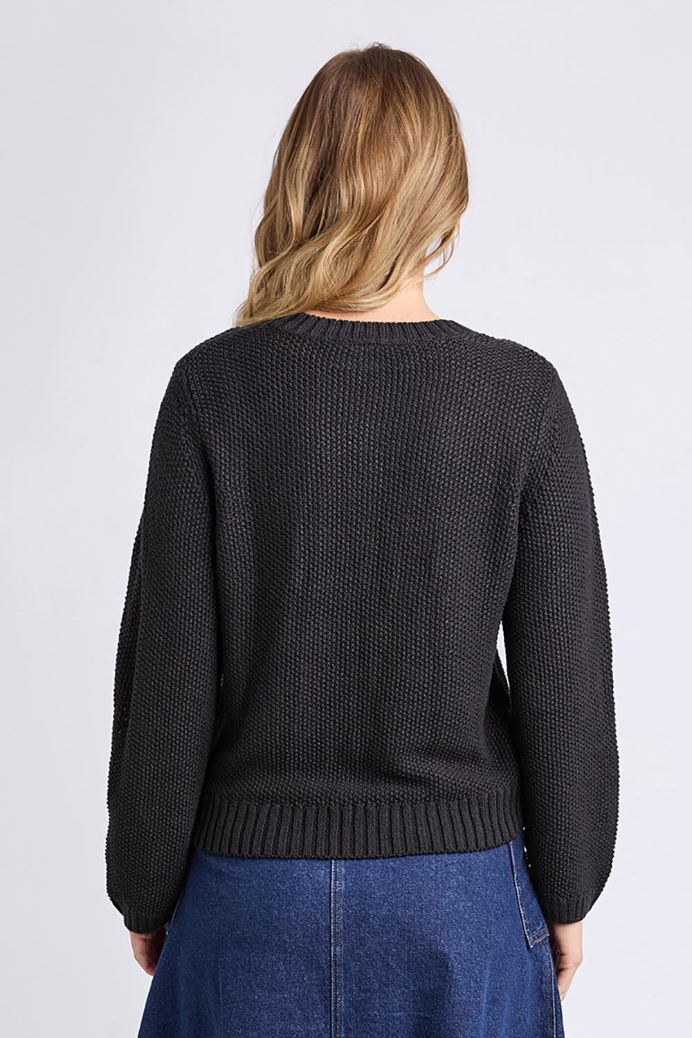 A model wearing the Blair Ls Knit in colour Black (Black), from the back