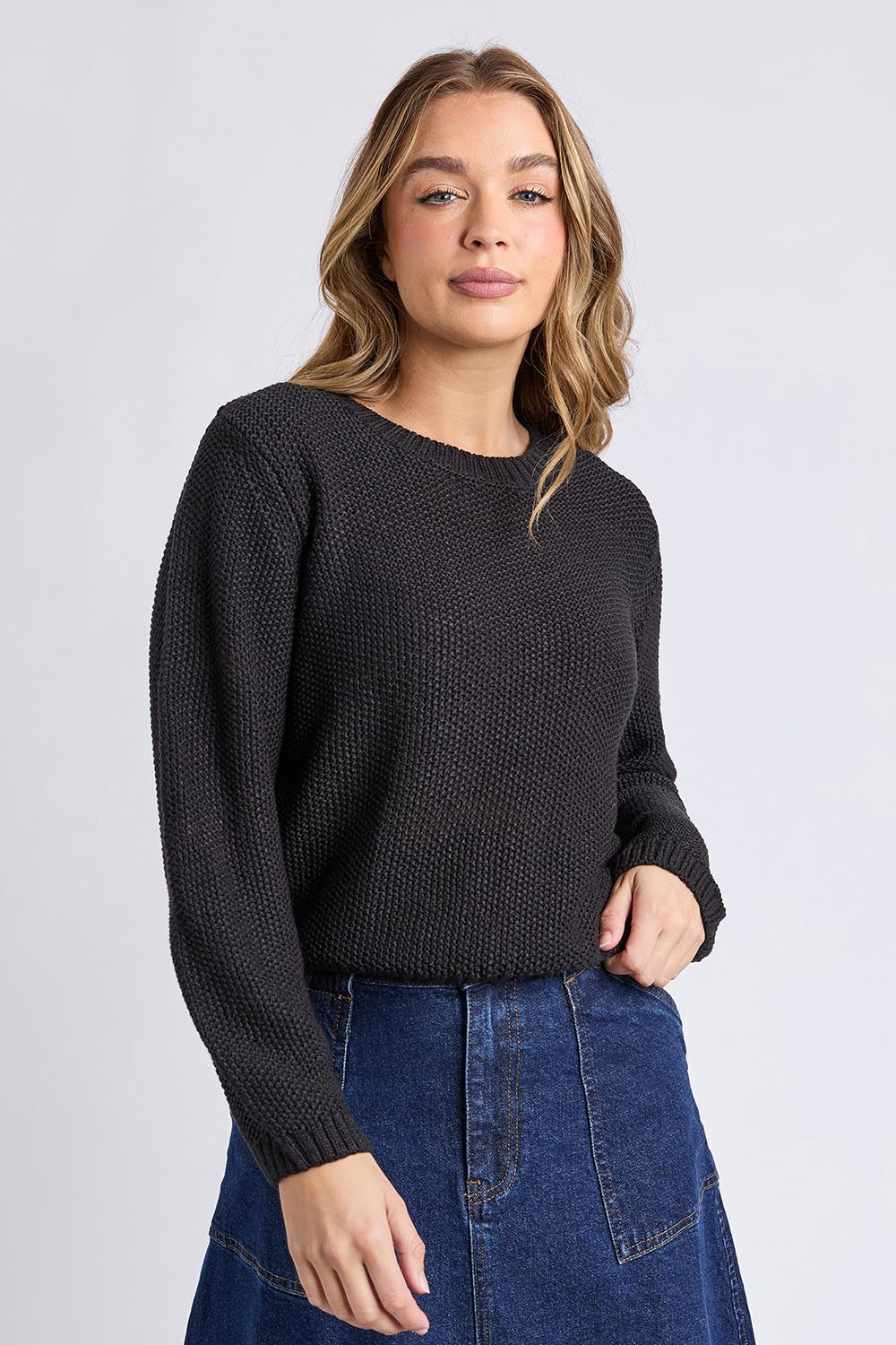 A model wearing the Blair Ls Knit in colour Black (Black), from the front, cropped image