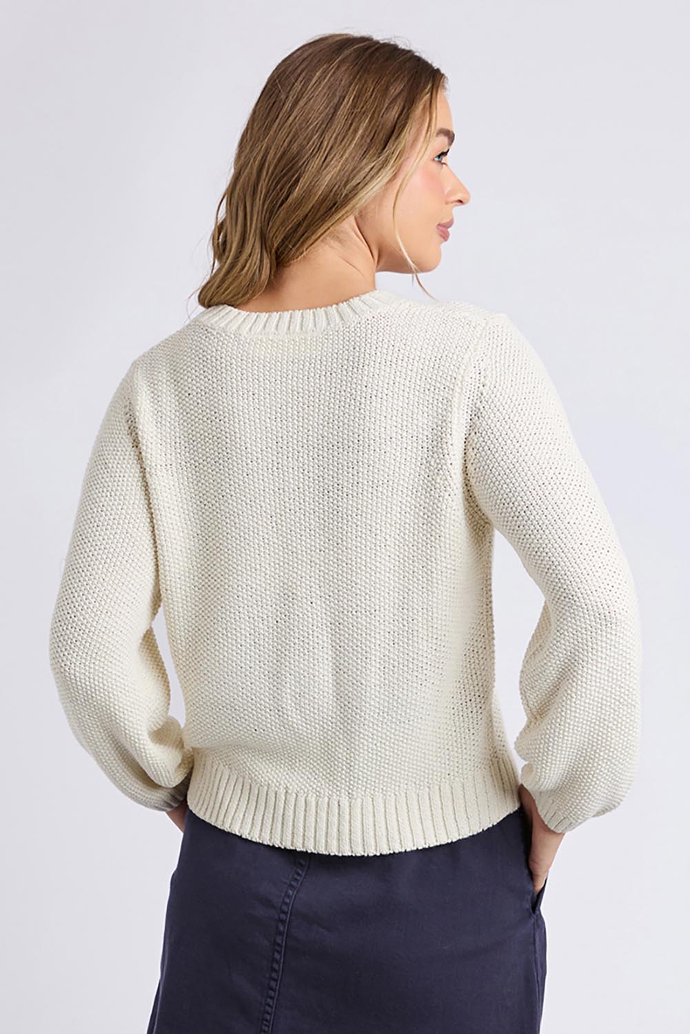 A model wearing the Blair Ls Knit in colour Vinwhite (White), from the back