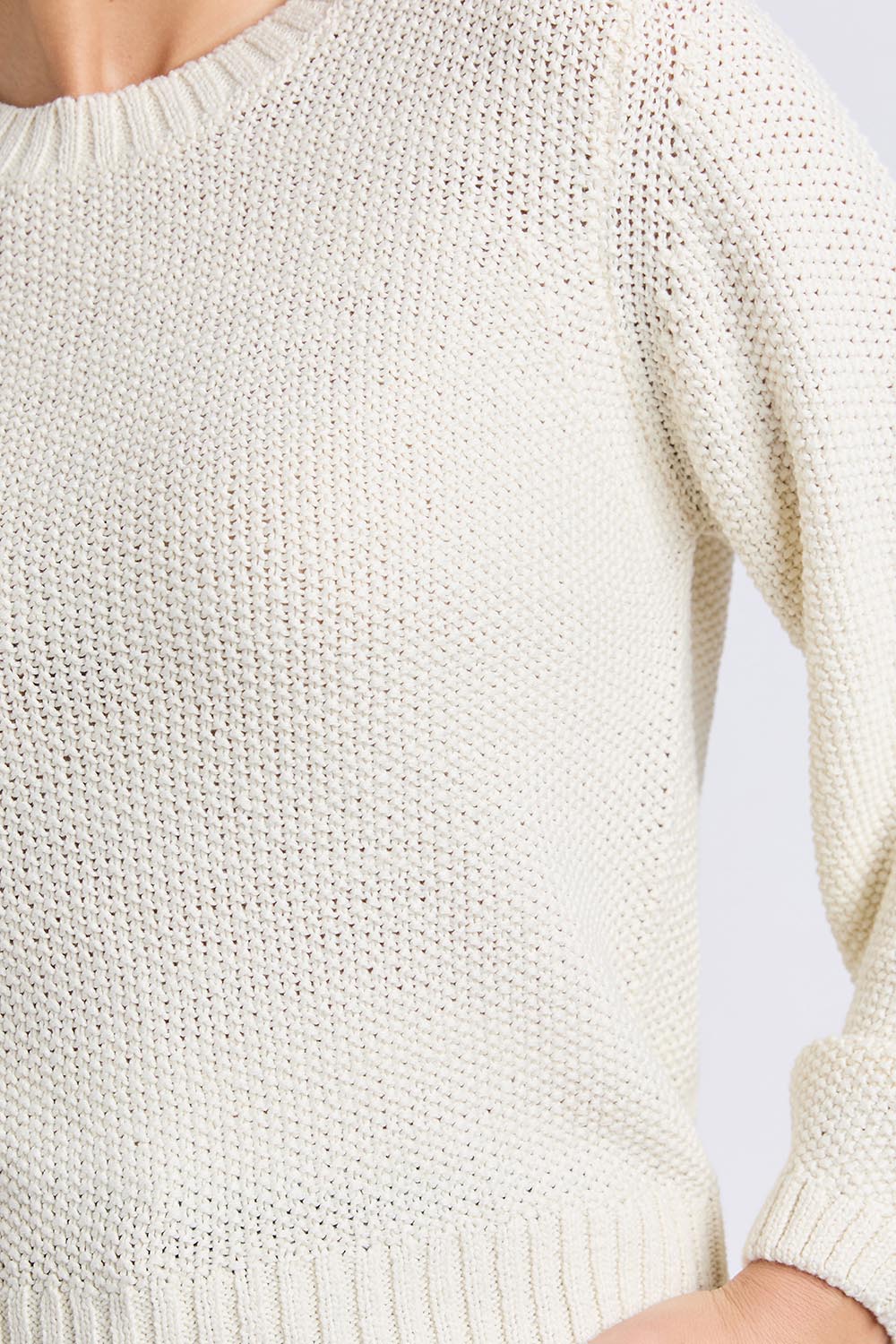 A model wearing the Blair Ls Knit in colour Vinwhite (White), from the front, cropped image