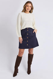 A model wearing the Blair Ls Knit in colour Vinwhite (White), from the front, showing the whole outfit