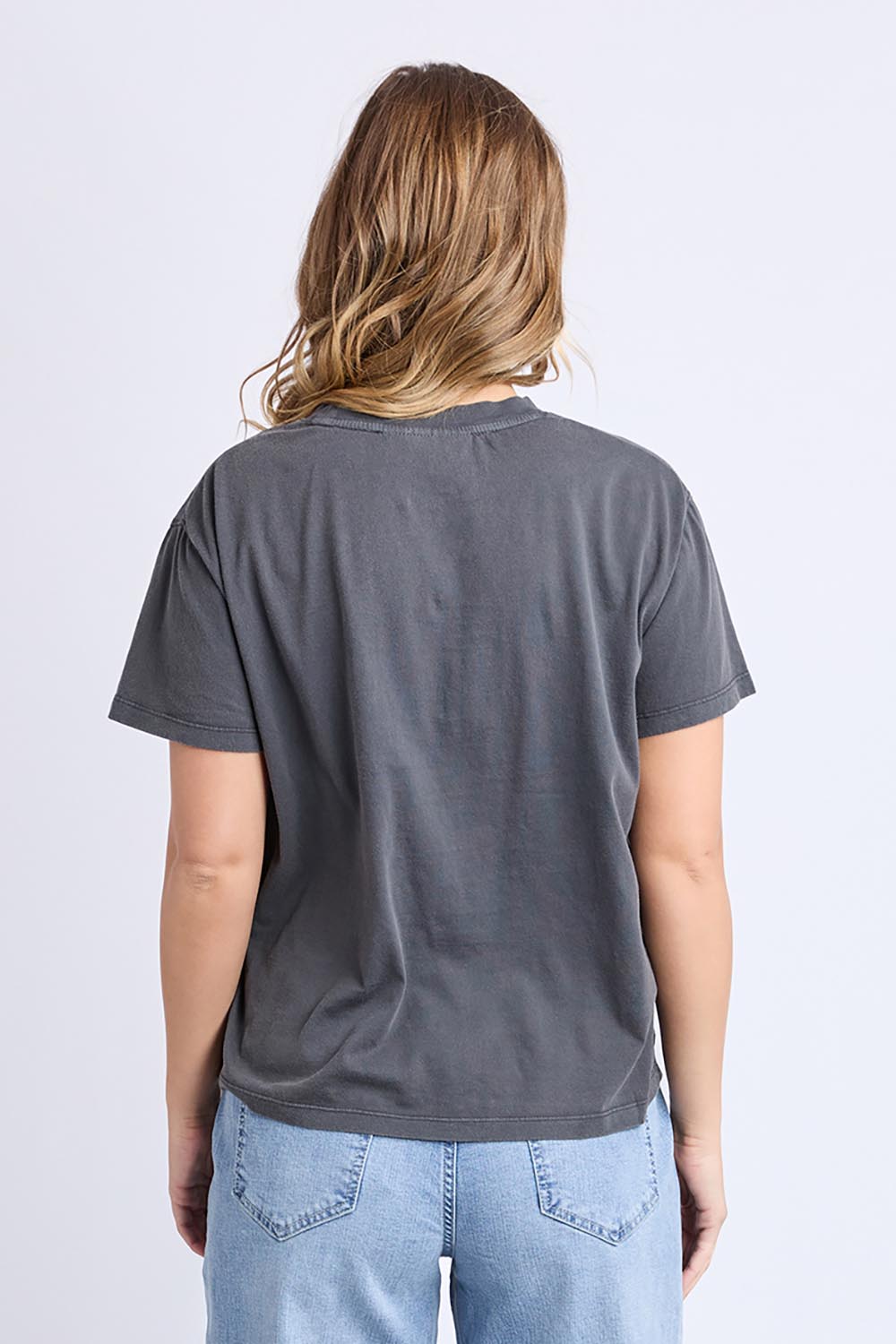 Model Genericm wearing size sample of the Tex Tee – Black in colour Black, from the back