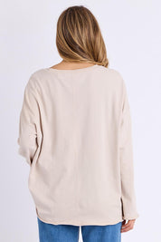 Model Genericm wearing size sample of the Bandit Boots Long Sleeve Tee – Oat in colour Oat, from the back