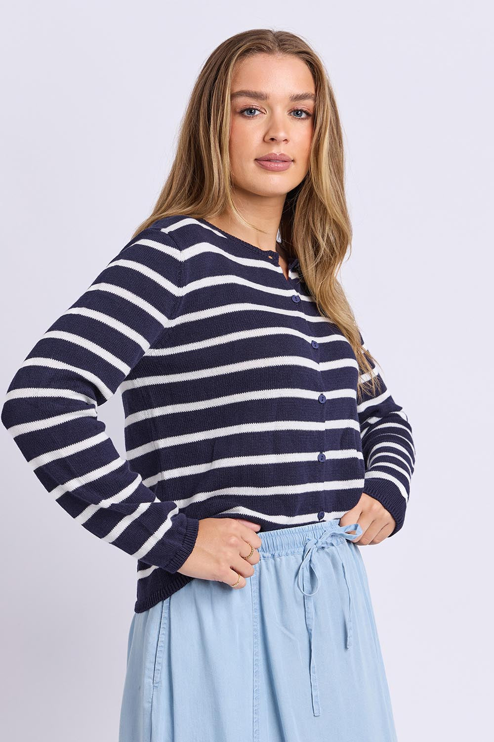 Model Genericm wearing size sample of the Eden Stripe Cardi – Dsapphire in colour Dsapphire, from an angle