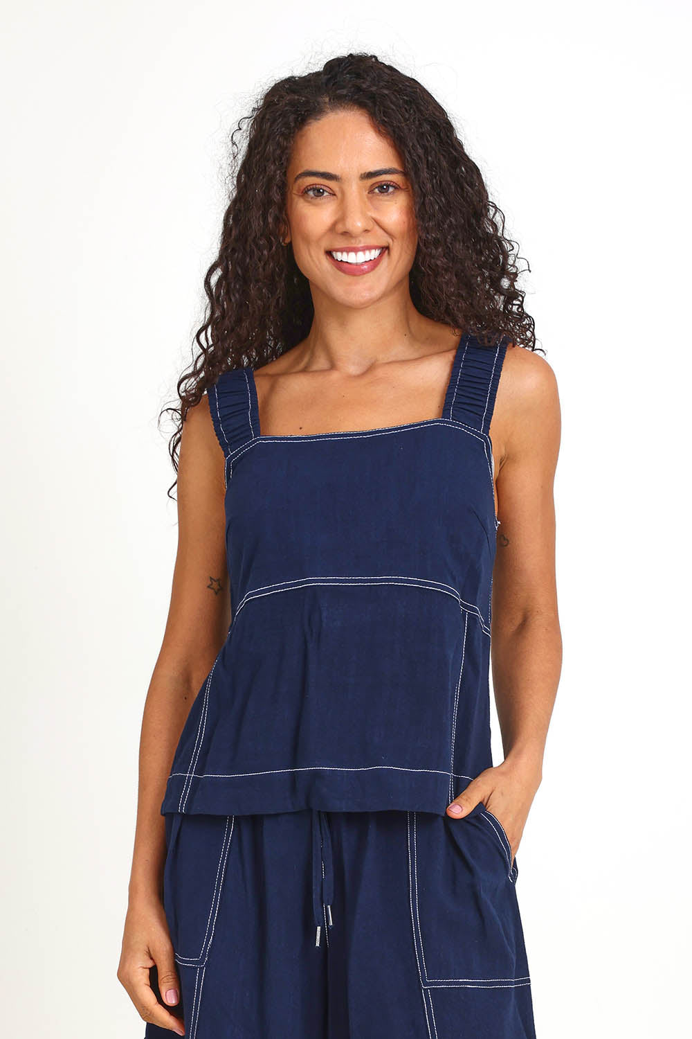 Model Pamelar wearing size 10 of the Sage Top – Dsapphire in colour Dsapphire, in a cropped view