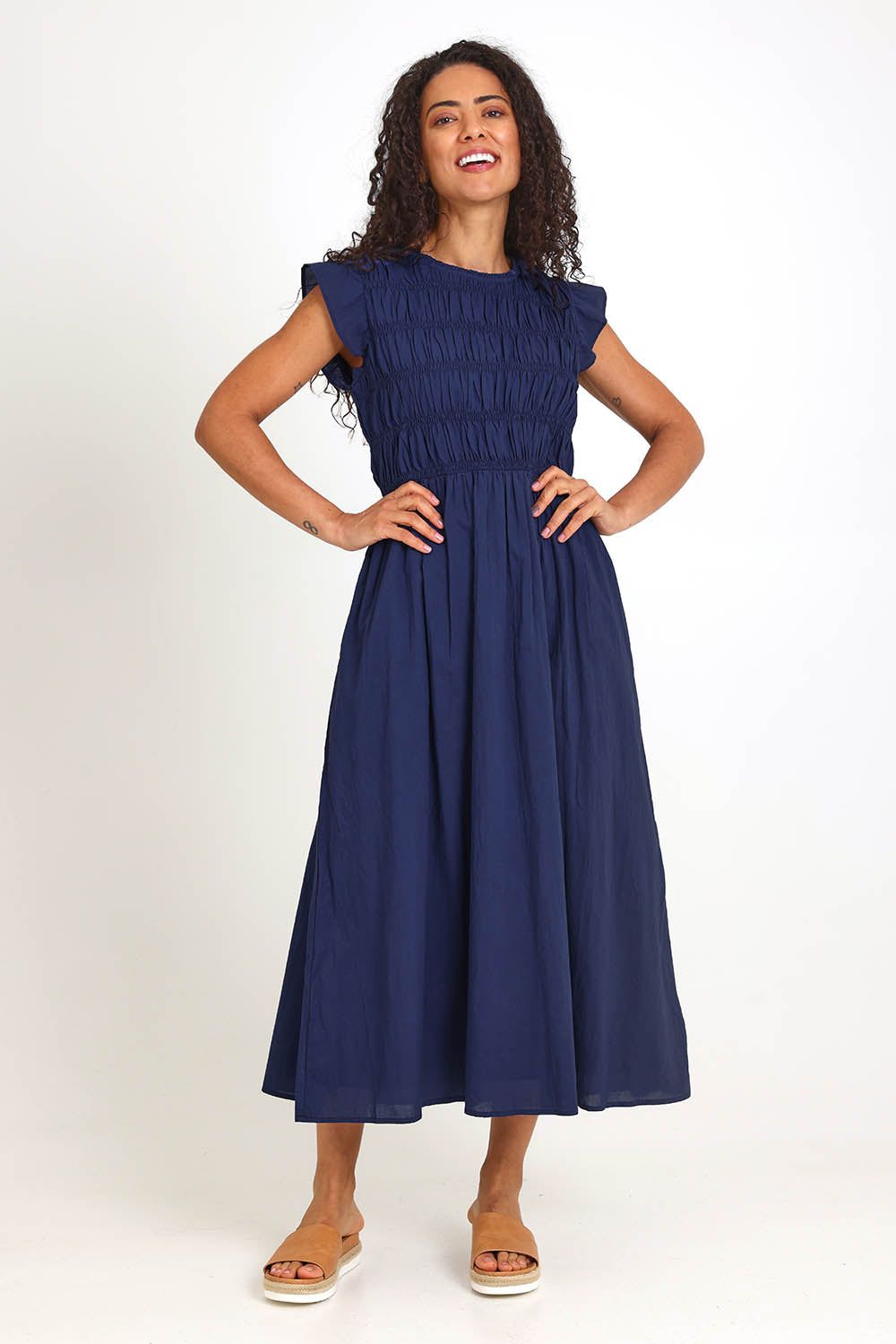 Model Pamelar wearing size 10 of the Memphis Dress – Deepblue in colour Deepblue, from the front
