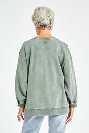 Model Elise wearing size 10 of the Everyday Crew in colour Greenmist (Green), from the back