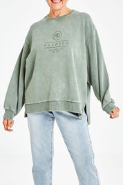 Model Elise wearing size 10 of the Everyday Crew in colour Greenmist (Green), from the front, cropped image