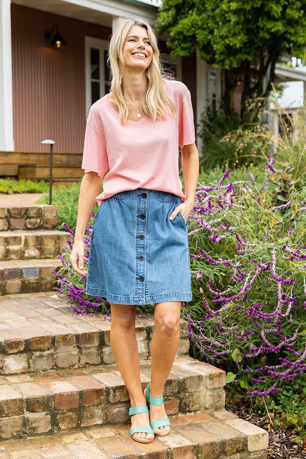 Model Kelly wearing size 10 of the Amanda Skirt in colour Denim (Blue), from the front, showing the whole outfit