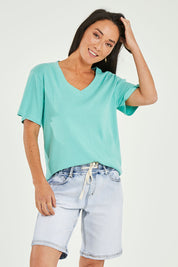 Model Katie wearing size 10 of the Gabby Bermuda in colour Lghtblue (Blue), from the front, cropped image