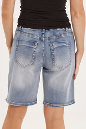 Model Sally wearing size 10 of the Gabby Bermuda in colour Midblue (Blue), from the back