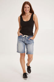 Model Sally wearing size 10 of the Gabby Bermuda in colour Midblue (Blue), from the front, showing the whole outfit