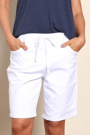 Model Pamelar wearing size 10 of the Gabby Bermuda - White in colour White, in a cropped view