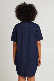 Model Olivia wearing size 10 of the Sorcha Denim Dress in colour Indigoden (Blue), from the back