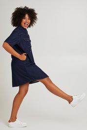 Model Olivia wearing size 10 of the Sorcha Denim Dress in colour Indigoden (Blue), from the front, showing the whole outfit
