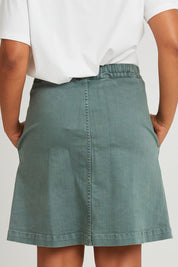 Model Olivia wearing size 10 of the Elements Amanda Skirt in colour Khaki (Green), from the back