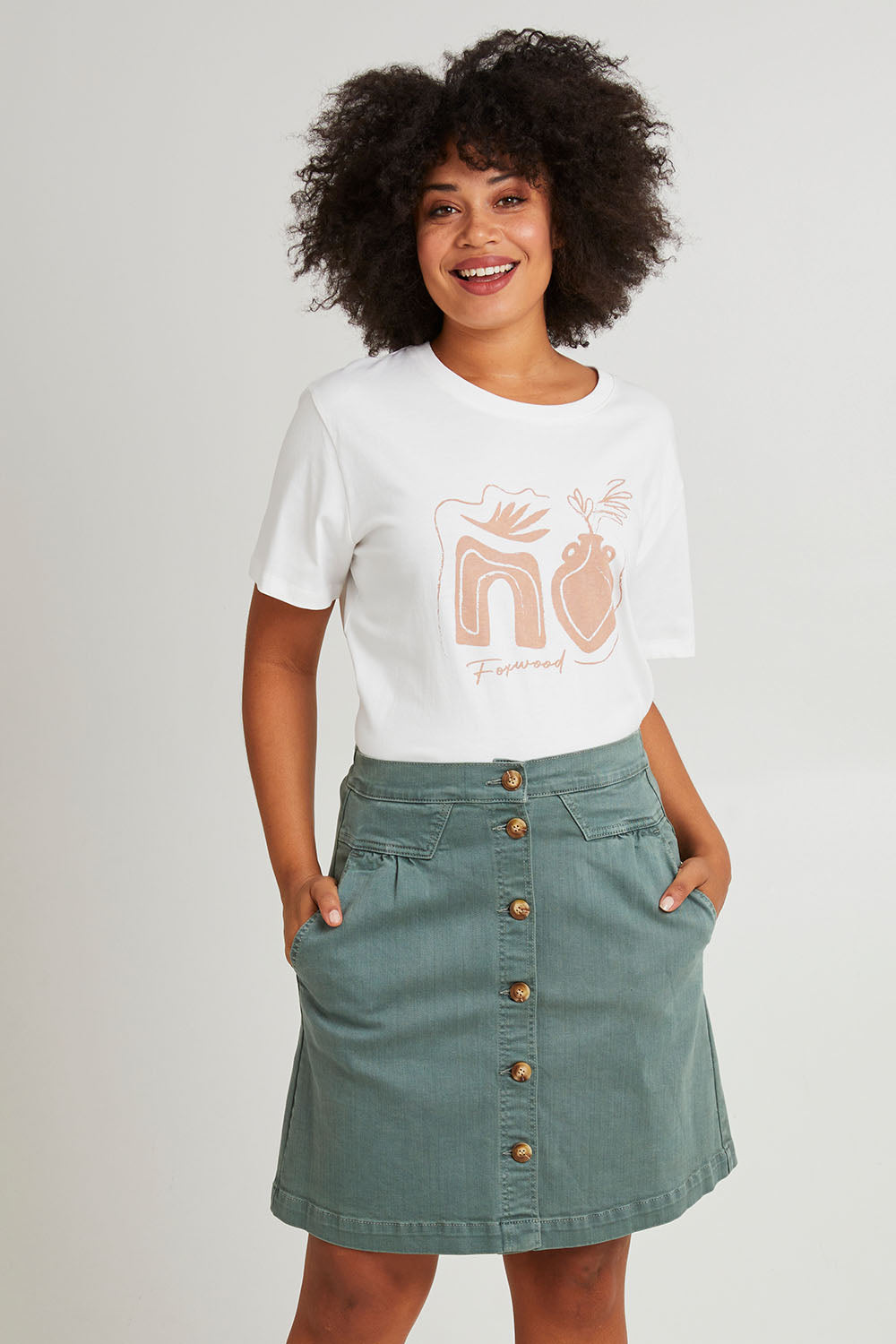 Model Olivia wearing size 10 of the Elements Amanda Skirt in colour Khaki (Green), from the front, cropped image