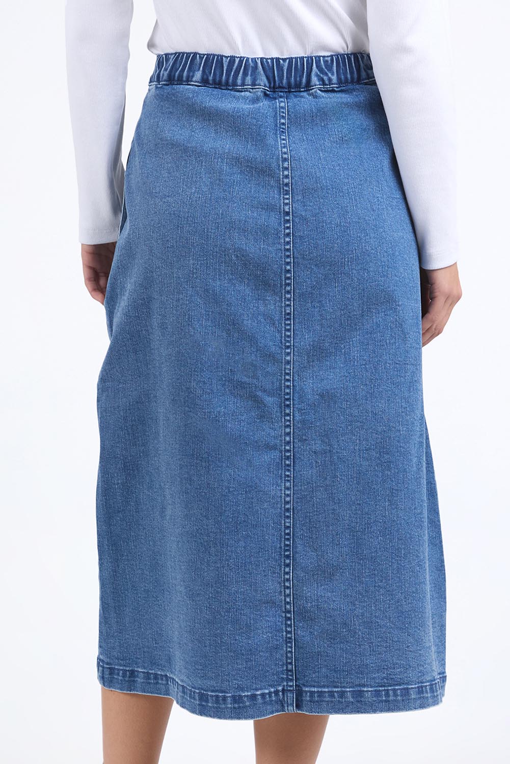 A model wearing the Amanda Cotton Blend Midi Skirt in colour Midblue (Blue), from the back