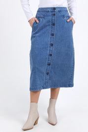 A model wearing the Amanda Cotton Blend Midi Skirt in colour Midblue (Blue), from the front, cropped image
