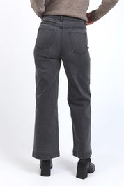 A model wearing the Sarah Wide Leg Jean in colour Washblack (Black), from the back