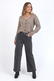 A model wearing the Sarah Wide Leg Jean in colour Washblack (Black), from the front, showing the whole outfit