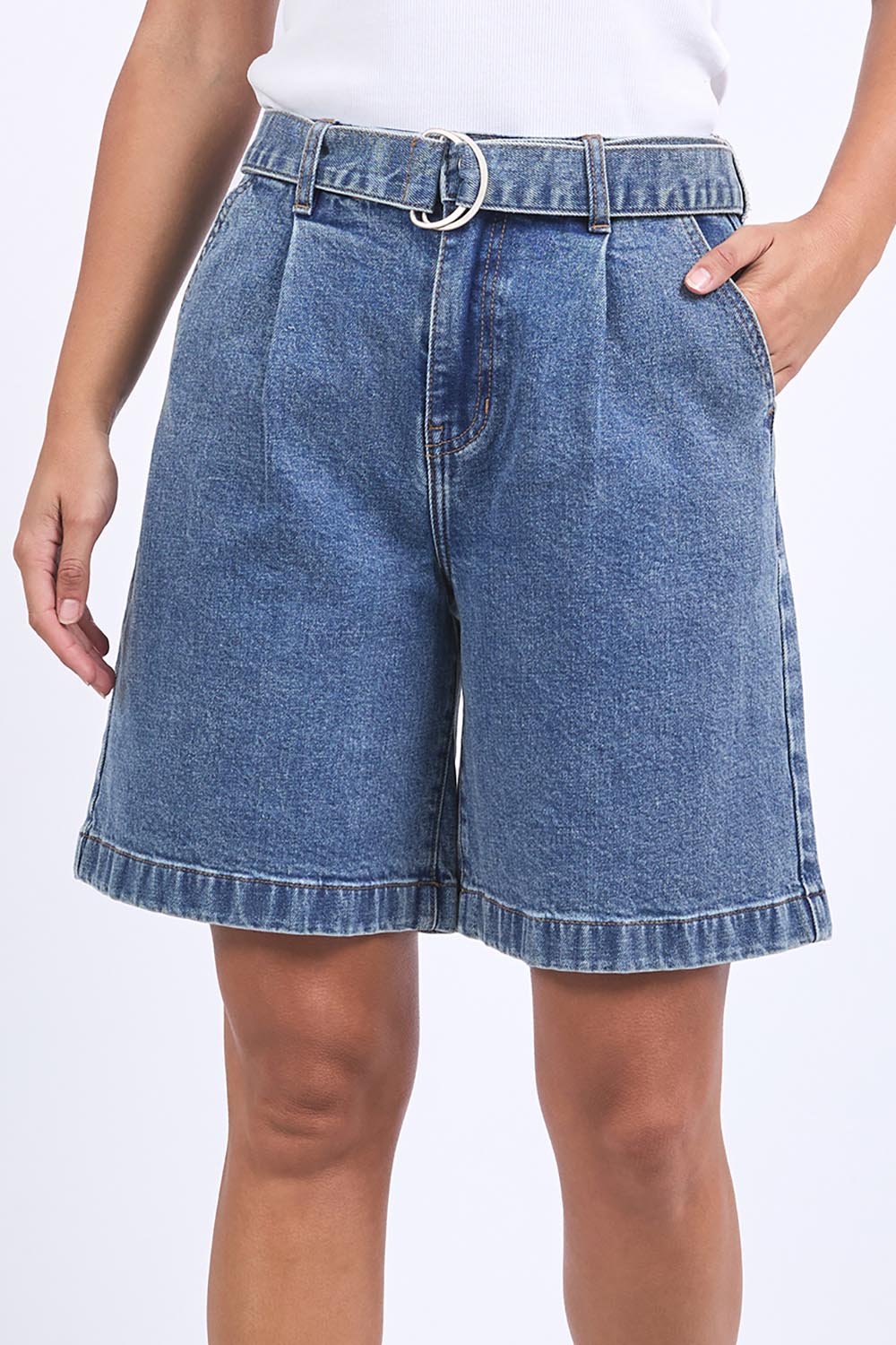 A model wearing the Saint Short in colour Midblue (Blue), from the front, cropped image