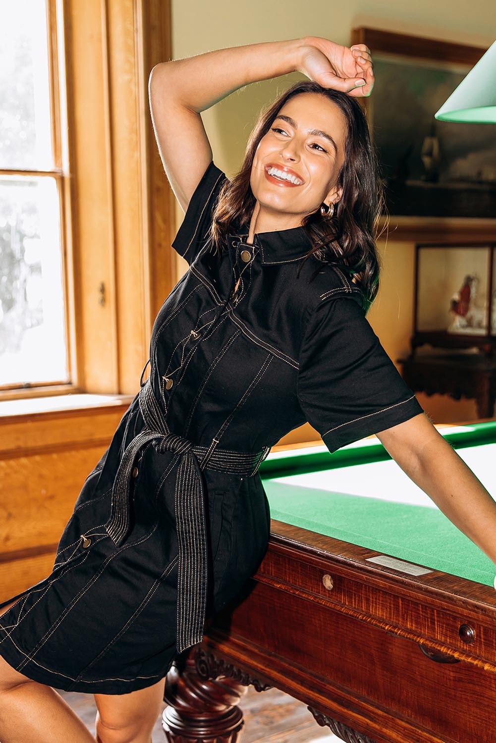 A model wearing the Riva Denim Dress in colour Black (Black), from the front, showing the whole outfit