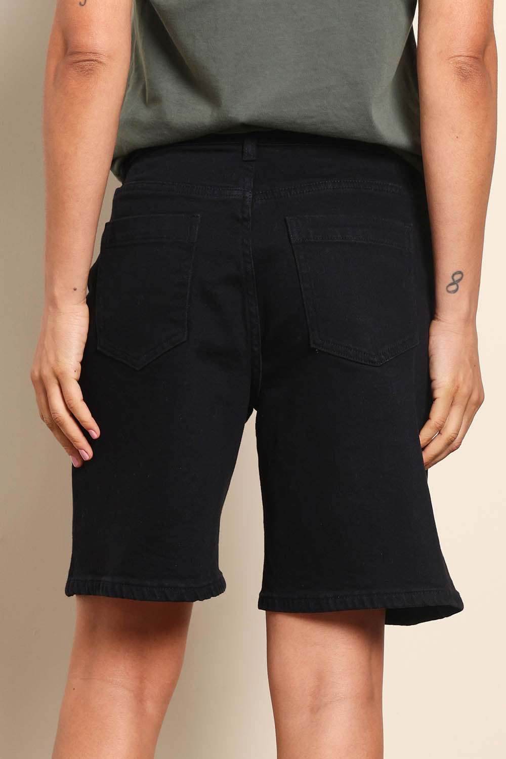 Model Pamelar wearing size 10 of the Elements Harley Denim Short - Black in colour Black, from the back