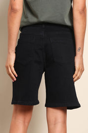 Model Pamelar wearing size 10 of the Elements Harley Denim Short - Black in colour Black, from the back
