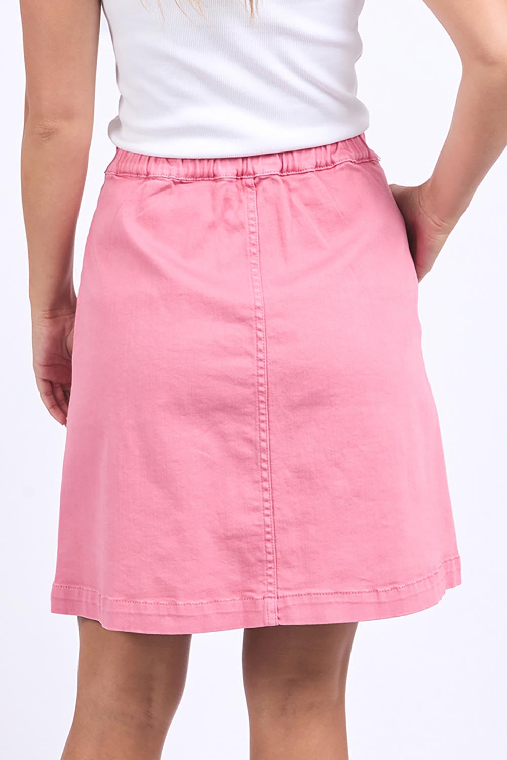 A model wearing the Elements Amanda Skirt in colour Muskpink (Pink), from the back