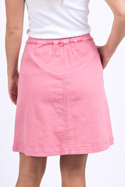 A model wearing the Elements Amanda Skirt in colour Muskpink (Pink), from the back