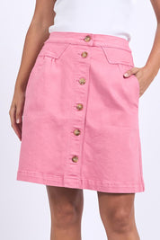 A model wearing the Elements Amanda Skirt in colour Muskpink (Pink), from the front, cropped image