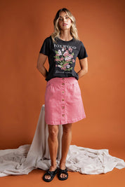 A model wearing the Elements Amanda Skirt in colour Muskpink (Pink), from the front, showing the whole outfit