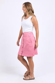 A model wearing the Elements Amanda Skirt in colour Muskpink (Pink), from the front, showing the whole outfit