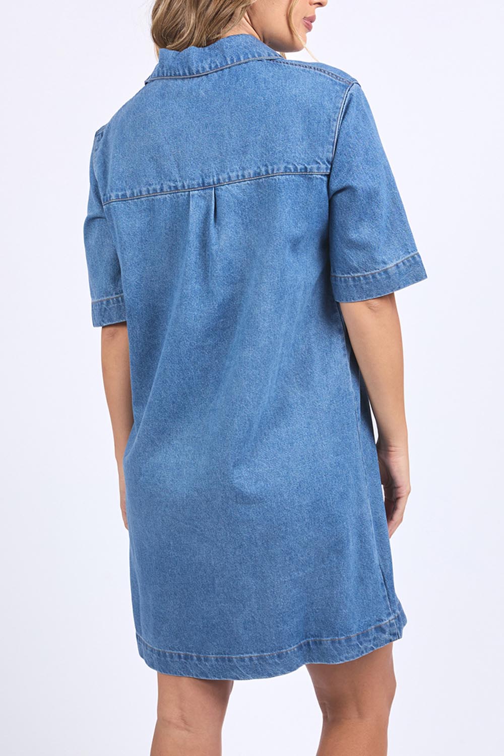 A model wearing the Monte Shirt Dress in colour Midblue (Blue), from the back