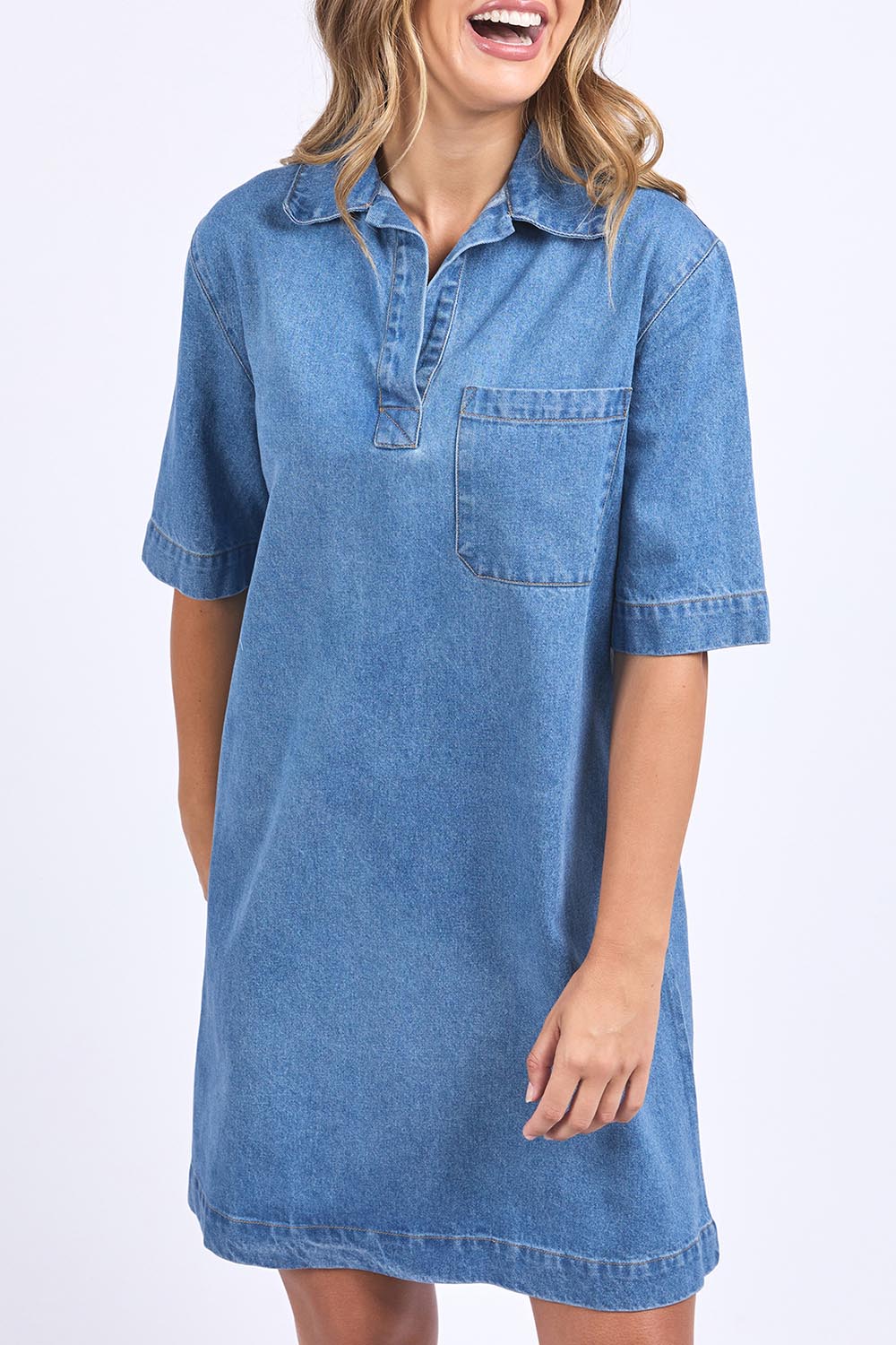 A model wearing the Monte Shirt Dress in colour Midblue (Blue), from the front, cropped image