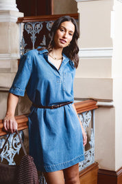 A model wearing the Monte Shirt Dress in colour Midblue (Blue), from the front, showing the whole outfit