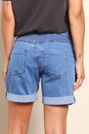 Model Pamelar wearing size 10 of the Elements Devi Denim Shorts - Midblue in colour Midblue, from the back