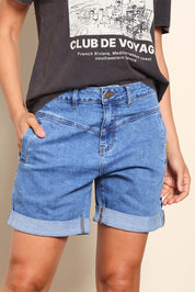 Model Pamelar wearing size 10 of the Elements Devi Denim Shorts - Midblue in colour Midblue, in a cropped view