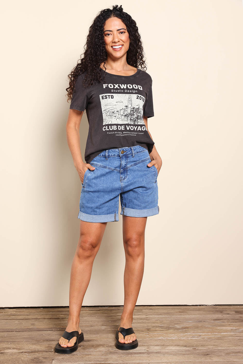 Model Pamelar wearing size 10 of the Elements Devi Denim Shorts - Midblue in colour Midblue, from the front