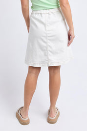 A model wearing the Elements Amanda Denim Skirt in colour White (White), from the back